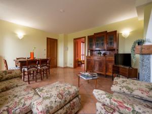 a living room with a couch and a table at Holiday Home Vallegra by Interhome in Cortiglione