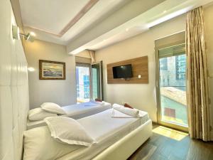 Voodi või voodid majutusasutuse Hotel Butua Residence toas