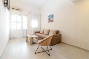 a living room with a couch and a table at Apartments Ada Bojana in Ulcinj