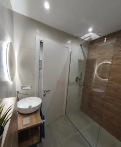 a bathroom with a shower and a sink at Playa degli Angeli Ponente in Gabicce Mare