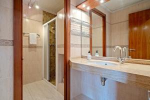 a bathroom with a sink and a shower at Ca la Francina in Torre del Español +26 photos