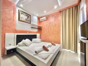 Katil atau katil-katil dalam bilik di Hotel Butua Residence