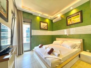 Katil atau katil-katil dalam bilik di Hotel Butua Residence