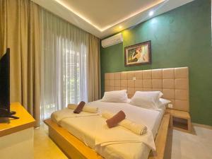 Katil atau katil-katil dalam bilik di Hotel Butua Residence