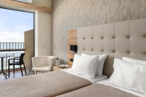 Postel nebo postele na pokoji v ubytování Stefania Hotel