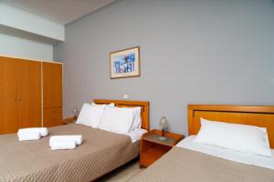 Postel nebo postele na pokoji v ubytování Stefania Hotel