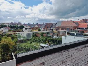 a balcony with a view of a city at Fáilte Muur in Geraardsbergen