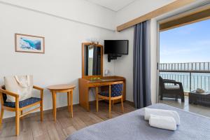 TV a/nebo společenská místnost v ubytování Stefania Hotel