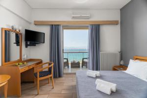 Postel nebo postele na pokoji v ubytování Stefania Hotel