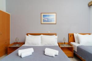 Postel nebo postele na pokoji v ubytování Stefania Hotel