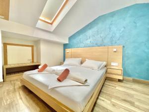 Katil atau katil-katil dalam bilik di Hotel Butua Residence