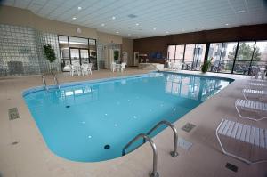 a large swimming pool in a large room at Visitor's Inn in Hamilton