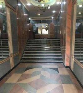 a hallway with a staircase in a building at شقة فاخرة في كمبوند ميامى جراند بلازا الإسكندرية in Alexandria