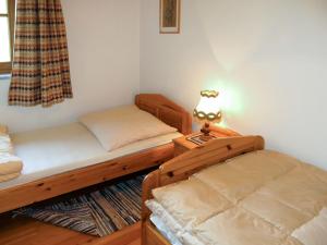 En eller flere senge i et værelse på Apartment Kunzhof-5 by Interhome