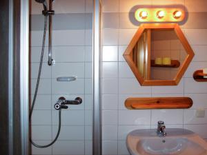 a bathroom with a sink and a shower at Apartment Kunzhof-5 by Interhome in Winklern