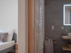 a bedroom with a bed and a window at Apartment Haut de Cry 16 by Interhome in Nendaz +38 photos