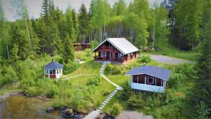 an aerial view of a house in a forest at Saimaa Raikala in Vuoriniemi