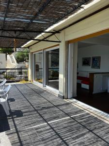 a patio with sliding glass doors and a bed at La Grande Terrazza in Portovenere