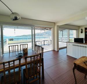 a dining room with a table and a view of the ocean at La Grande Terrazza in Portovenere