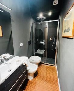 a bathroom with a toilet and a sink and a shower at La Grande Terrazza in Portovenere