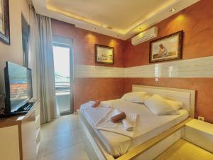 Katil atau katil-katil dalam bilik di Hotel Butua Residence