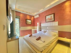 Katil atau katil-katil dalam bilik di Hotel Butua Residence