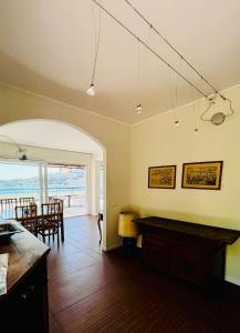 a kitchen and dining room with a view of the ocean at La Grande Terrazza in Portovenere +44 photos
