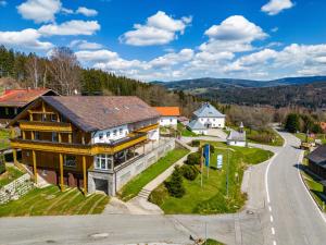 a large house on a hill with a road at Holiday Home Bayerisch Häusl by Interhome in Bayerisch Eisenstein