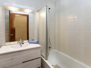 a bathroom with a sink and a tub and a shower at Apartment Puig Sapera by Interhome in Sant Antoni de Calonge