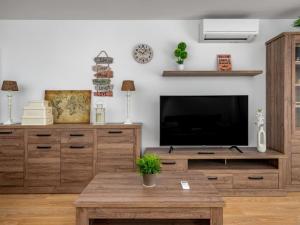 a living room with a tv and a coffee table at Apartment Atria-3 by Interhome in Torremolinos