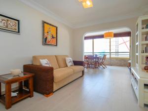 a living room with a couch and a table at Apartment Etxezuri by Interhome in Calpe