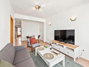 a living room with a couch and a tv at Apartment Puerto Denia Cervantes-2 by Interhome in Denia
