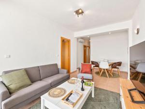 a living room with a couch and a table at Apartment Puerto Denia Cervantes-2 by Interhome in Denia
