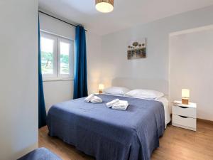 Ένα ή περισσότερα κρεβάτια σε δωμάτιο στο Holiday Home Kosić by Interhome