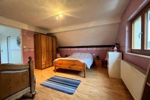 Ένα ή περισσότερα κρεβάτια σε δωμάτιο στο Appartement indépendant à proximité de Belfort