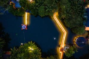 an aerial view of a resort pool at night at Hilton Seychelles Labriz Resort & Spa in Silhouette Island
