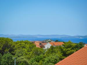 a view of the water from the roofs of buildings at Holiday Home Milena by Interhome in Pakoštane