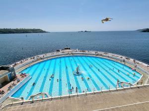 a large swimming pool in the middle of the water at Plymouth Hoe Central * Free Parking * Ocean Reach in Plymouth