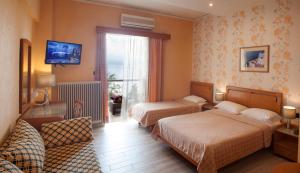 Postel nebo postele na pokoji v ubytování Stefania Hotel