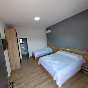 Postel nebo postele na pokoji v ubytování Hotel Erandi