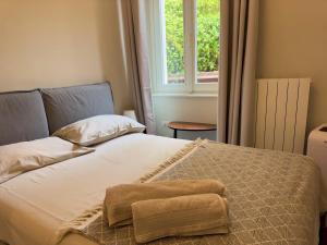a bedroom with a bed with a blanket on it at Appartme Stampa 1 in Milan