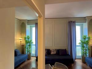 a living room with a couch and some windows at Appartme Stampa 1 in Milan