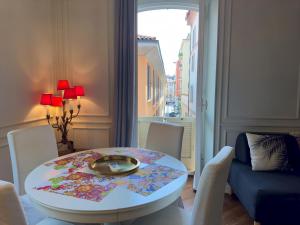 a room with a table and chairs and a window at Appartme Stampa 1 in Milan +13 photos