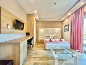 Televisyen dan/atau pusat hiburan di Hotel Butua Residence