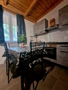 a kitchen with a table with chairs and a stove at Camping Onda Azzurra in Ortona
