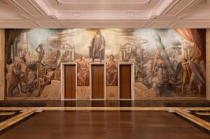 a mural in a room with a painting on the wall at Sina Bernini Bristol, Autograph Collection in Rome
