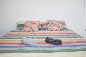 a bed with two towels and two pillows on it at Apartament nad Ustroniem in Gołdap