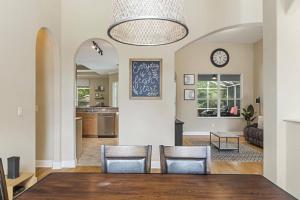 a dining room and living room with a table and chairs at Evans Dr Endless Summer Pool Home Close To Golf Course Palm Coast Pet Friendly in Palm Coast