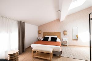 Postel nebo postele na pokoji v ubytování Hôtel Le Ribéral