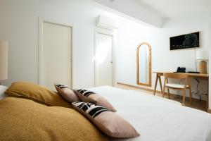 Postel nebo postele na pokoji v ubytování Hôtel Le Ribéral